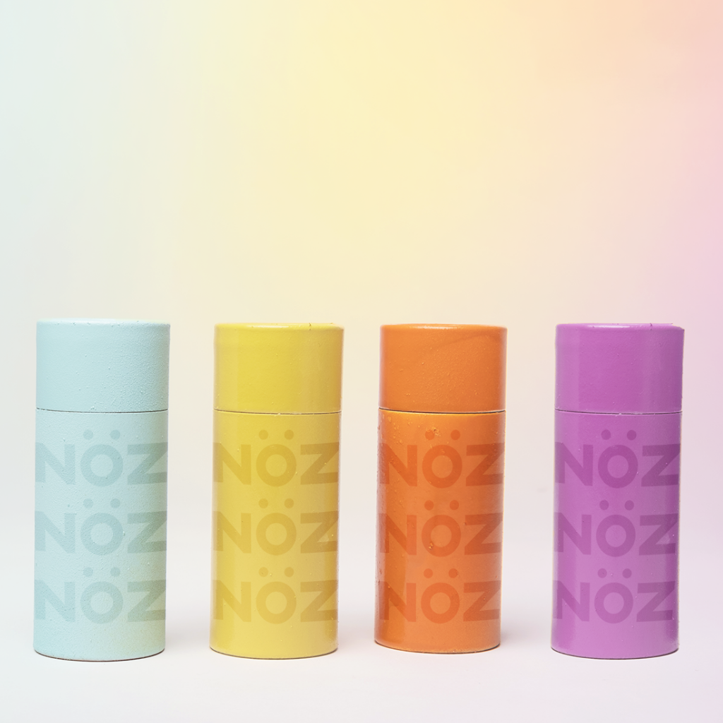 NOZ fun colorful blue, yellow, orange, and purple sunscreen for face.